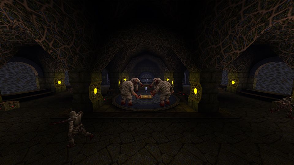 A person wearing armor walking towards a chest in a darkly lit room.